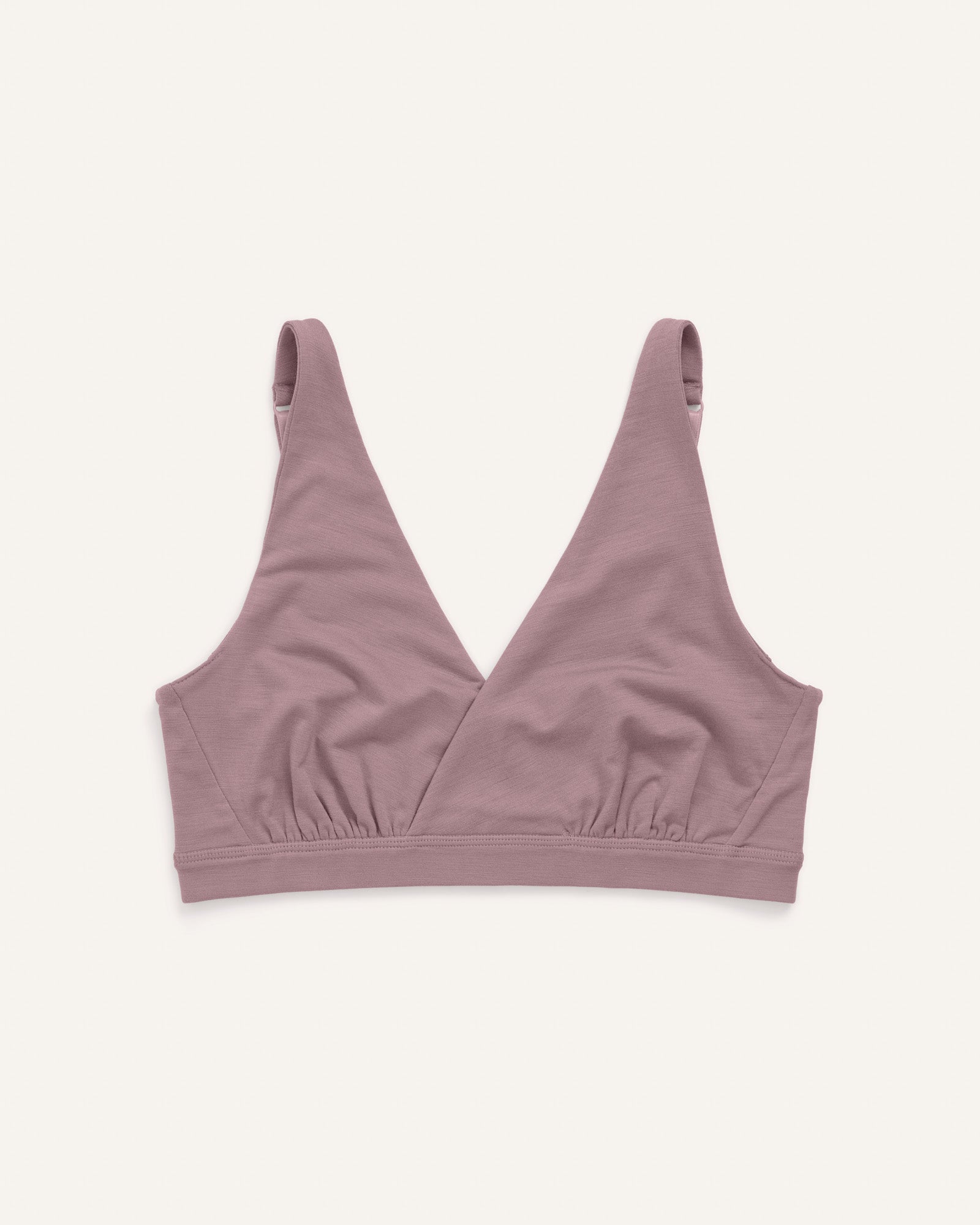 Laydown of Roam Convertible Wrap Bra in Lavender, a dusky, muted purple color. Roam Convertible Wrap Bra is a merino wool underwear available in sizes XS-XXL.