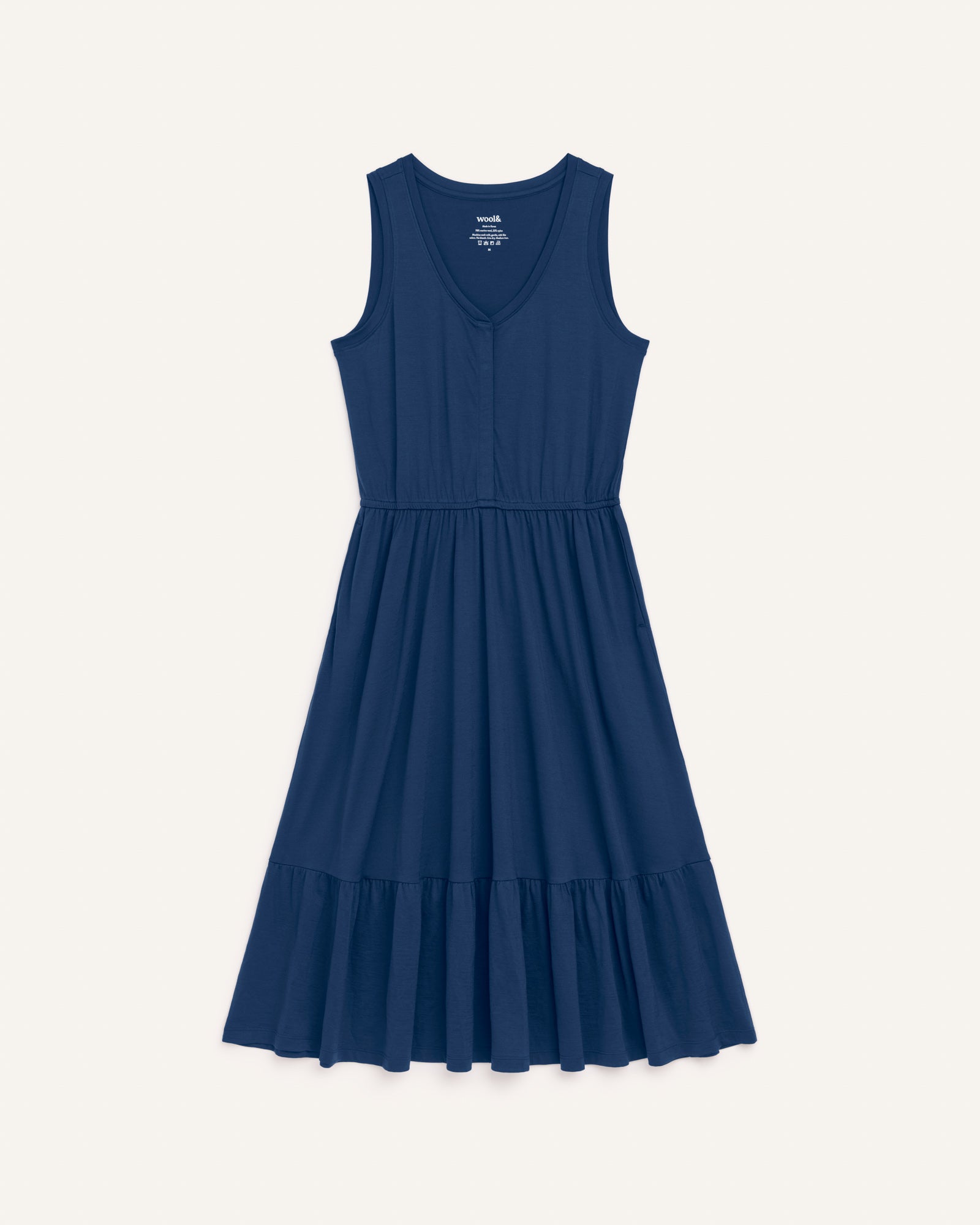 Laydown of Grace Tiered Dress in Marine Blue, a deep royal blue color. Grace Tiered Dress is a merino wool sleeveless, scoop neck, midi fit & flare dress with pockets available in sizes XS-3X.