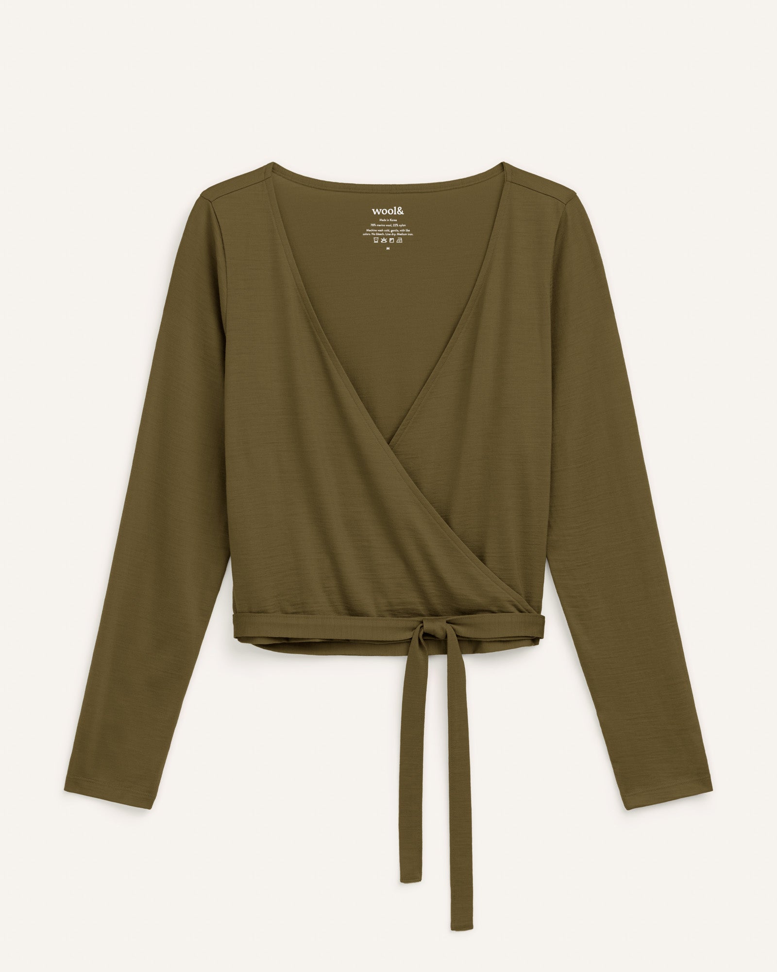 Laydown of Natalia Wrap Top in Olive. Natalia Wrap Top is a merino wool long sleeve, v-neck, slim fit top available in sizes XS-3X.