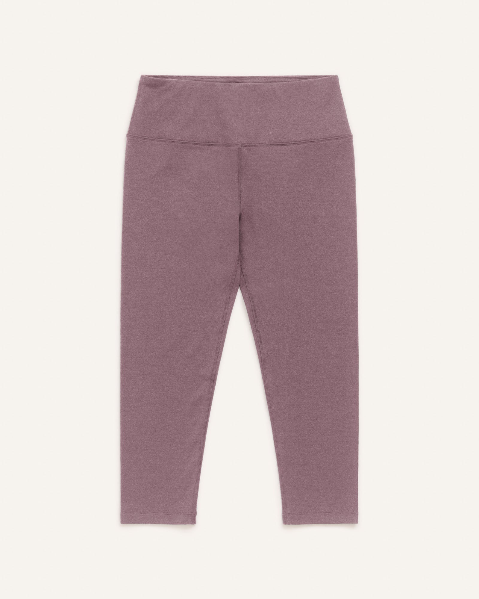 Laydown of Summit Crop Legging in Lavender, a dusky muted purple color. Summit Crop Legging is a merino wool legging available in sizes XS-3X.