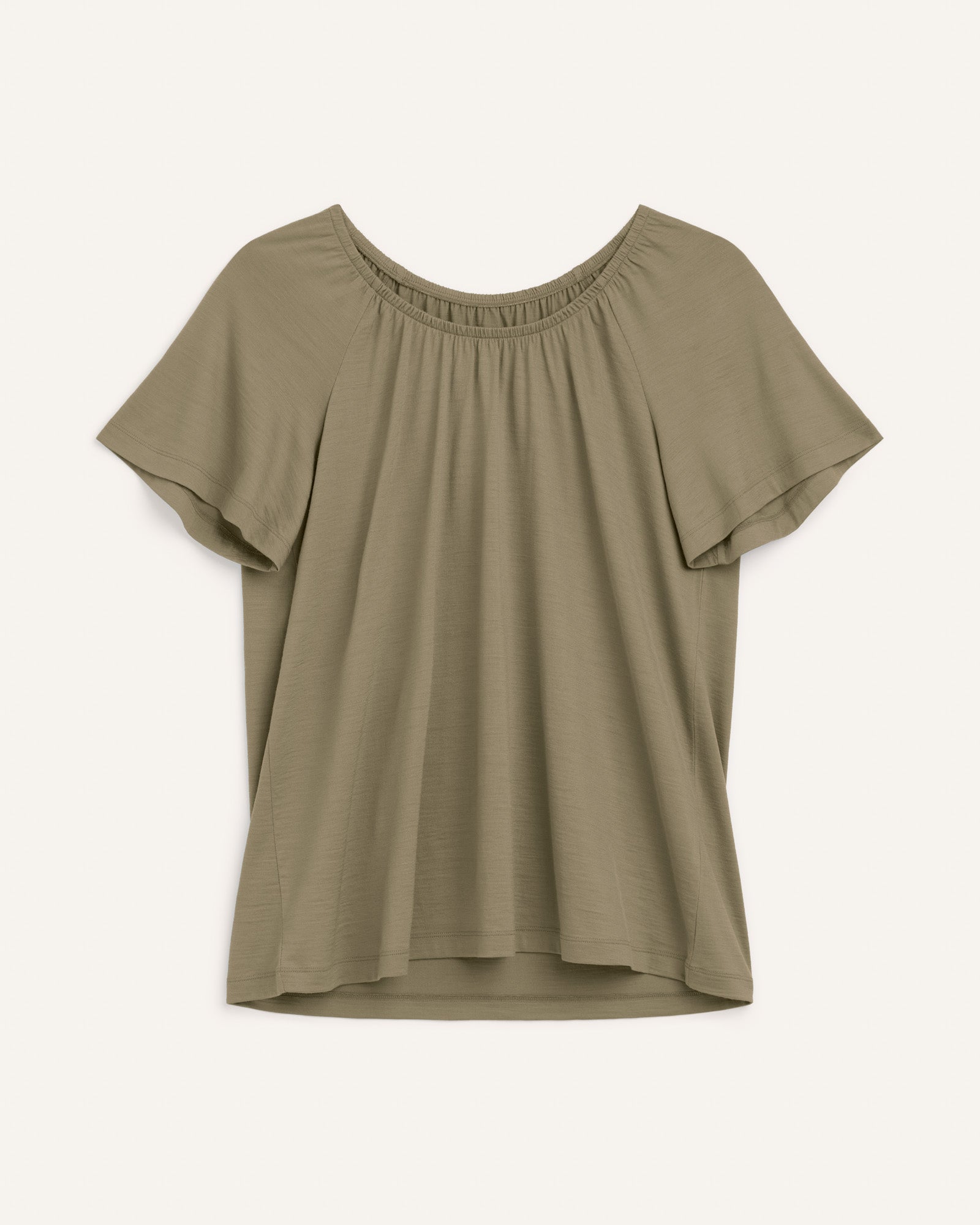 Laydown of Lilah Signature Gathered Neck Tee in Sage Green, a soft muted green color. Lilah Signature Gathered Neck Tee is a merino wool short sleeve, scoop neck, relaxed fit tee available in sizes XS-3X.