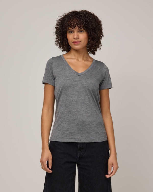 Model wearing Morgan V-Neck Tee in Charcoal Heather. Morgan V-Neck Tee is a merino wool short sleeve, v-neck, regular fit tee available in sizes XS-3X.