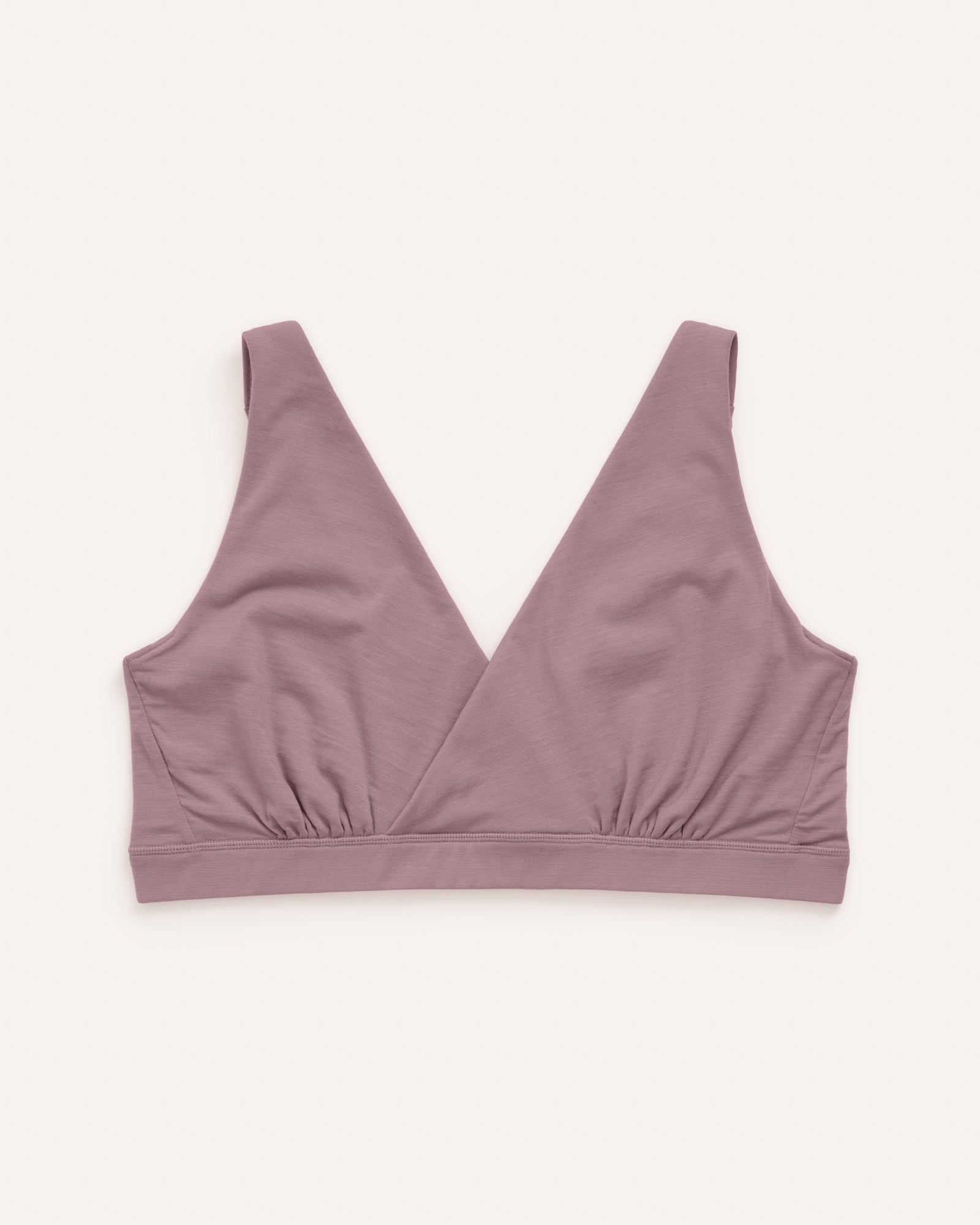 Laydown of Roam Wrap Bra in Lavender, a dusky muted purple color. Roam Wrap Bra is a merino wool underwear item available in sizes 1X-3X.
