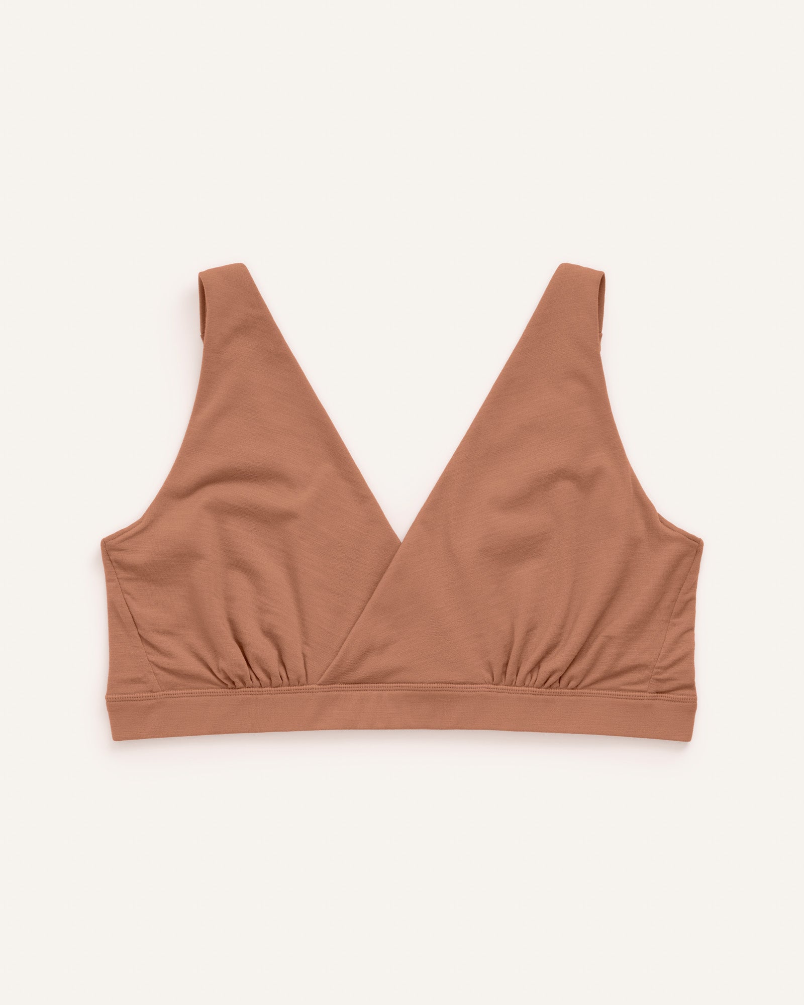 Laydown of Roam Wrap Bra in Mocha Brown, a medium-dark nude color. Roam Wrap Bra is a merino wool underwear available in sizes 1X-3X.
