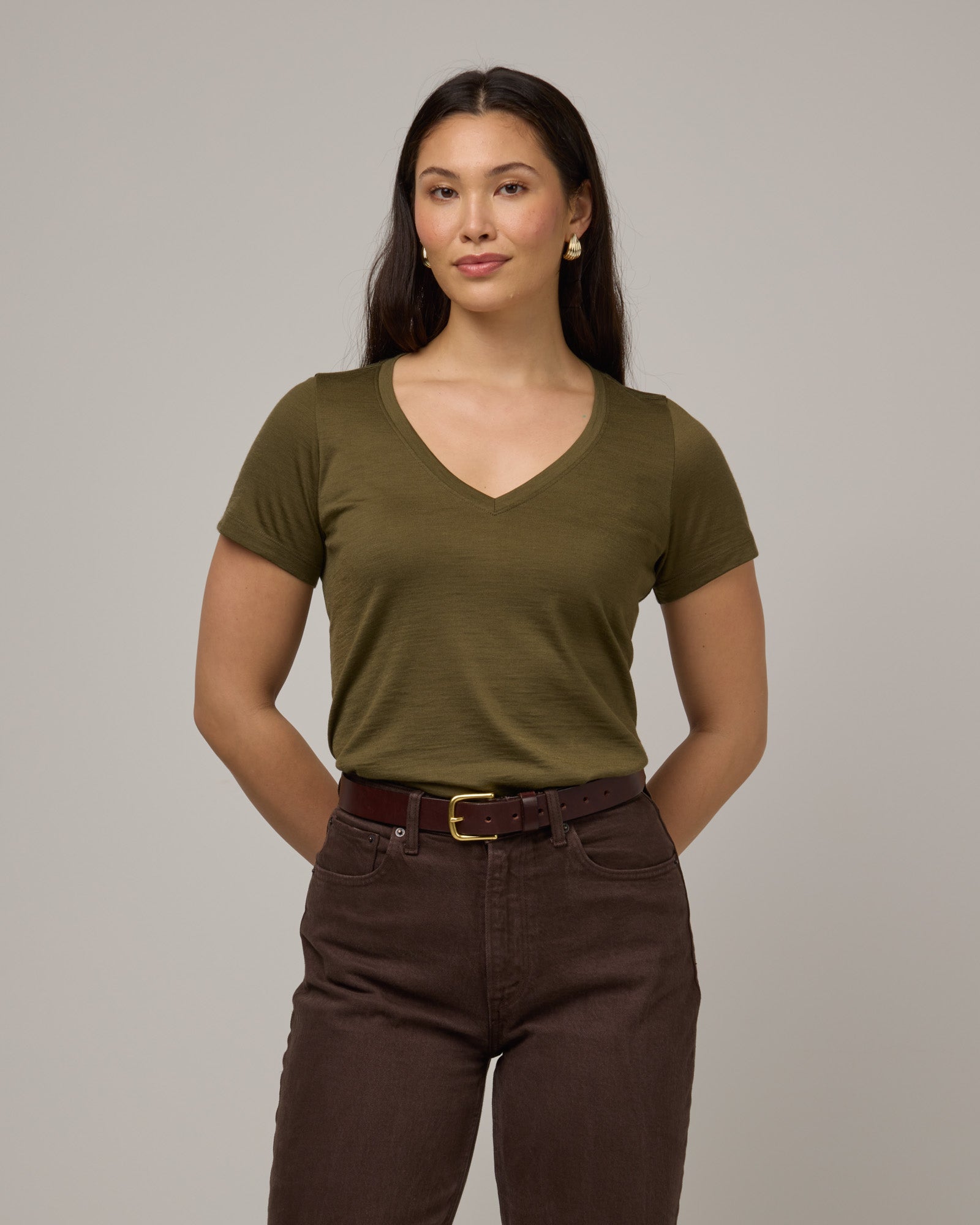Model wearing Morgan V-Neck Tee in Olive. Morgan V-Neck Tee is a merino wool short sleeve, v-neck, regular fit tee available in sizes XS-3X.