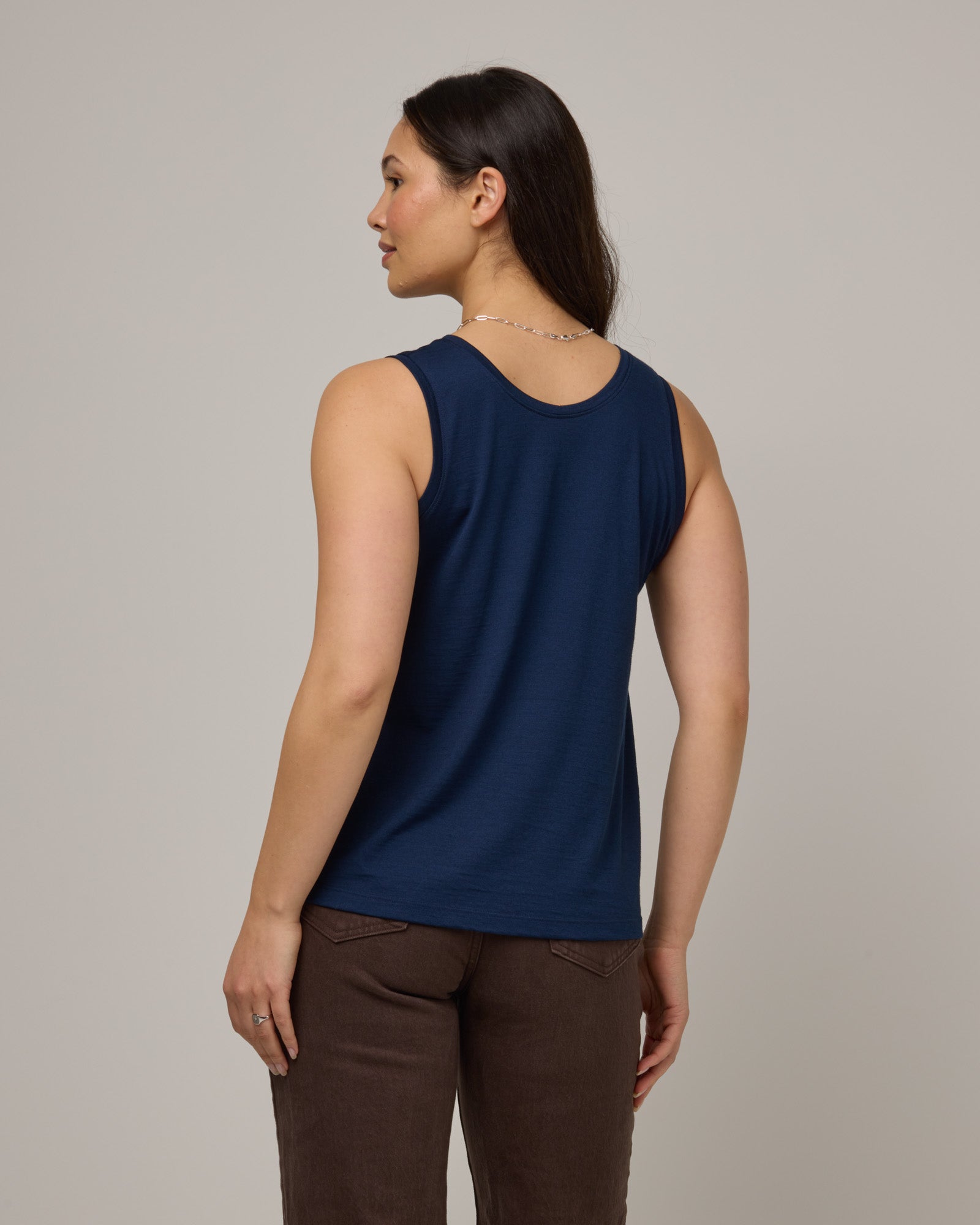 Model wearing Poppy Signature Reversible Tank in Marine Blue, a deep royal blue color. Poppy Signature Reversible Tank is a merino wool sleeveless, reversible, relaxed fit top available in sizes XS-3X.