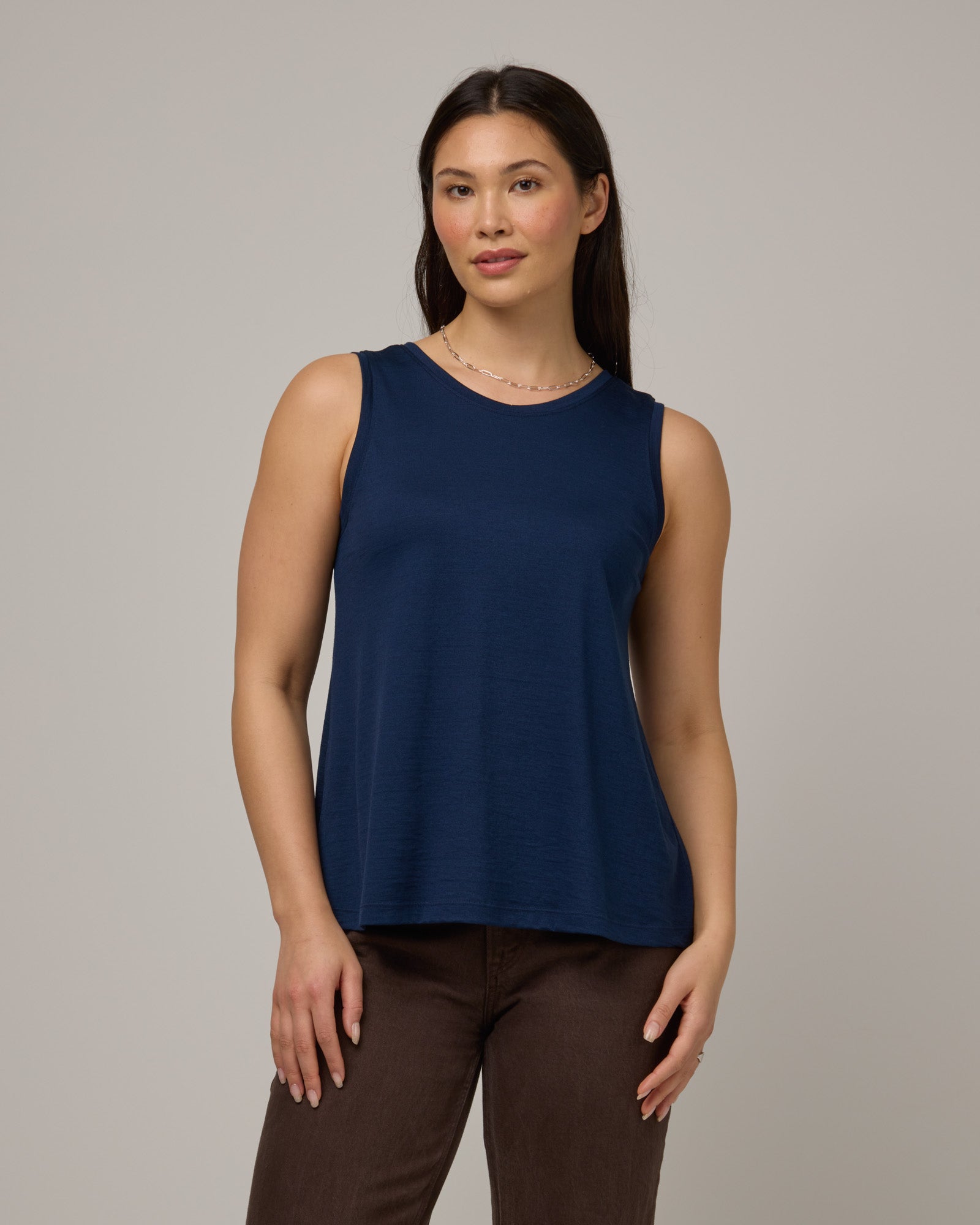 Model wearing Poppy Signature Reversible Tank in Marine Blue, a deep royal blue color. Poppy Signature Reversible Tank is a merino wool sleeveless, reversible, relaxed fit top available in sizes XS-3X.