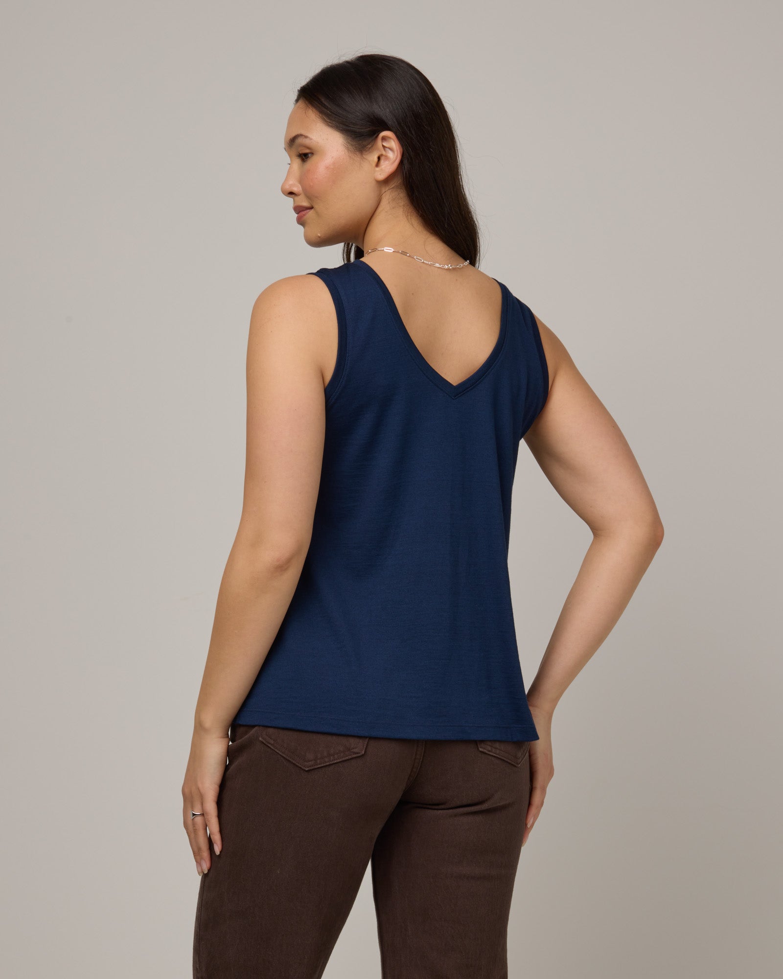 Model wearing Poppy Signature Reversible Tank in Marine Blue, a deep royal blue color. Poppy Signature Reversible Tank is a merino wool sleeveless, reversible, relaxed fit top available in sizes XS-3X.