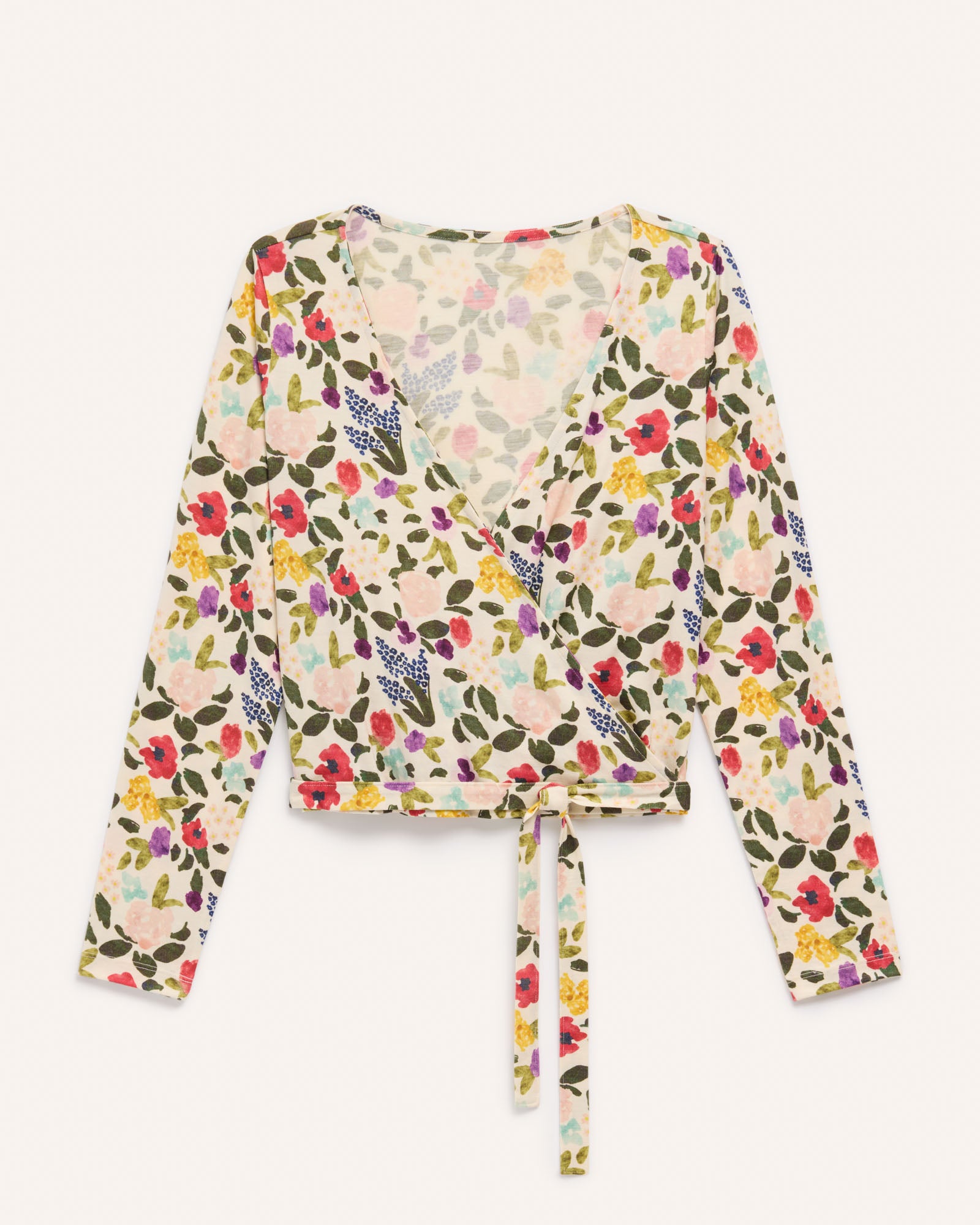 Laydown of Natalia Wrap Top in Watercolor Floral Print, a multi-colored floral print on a cream background. Natalia Wrap Top is a merino wool long sleeve, v-neck, slim fit top available in sizes XS-3X.