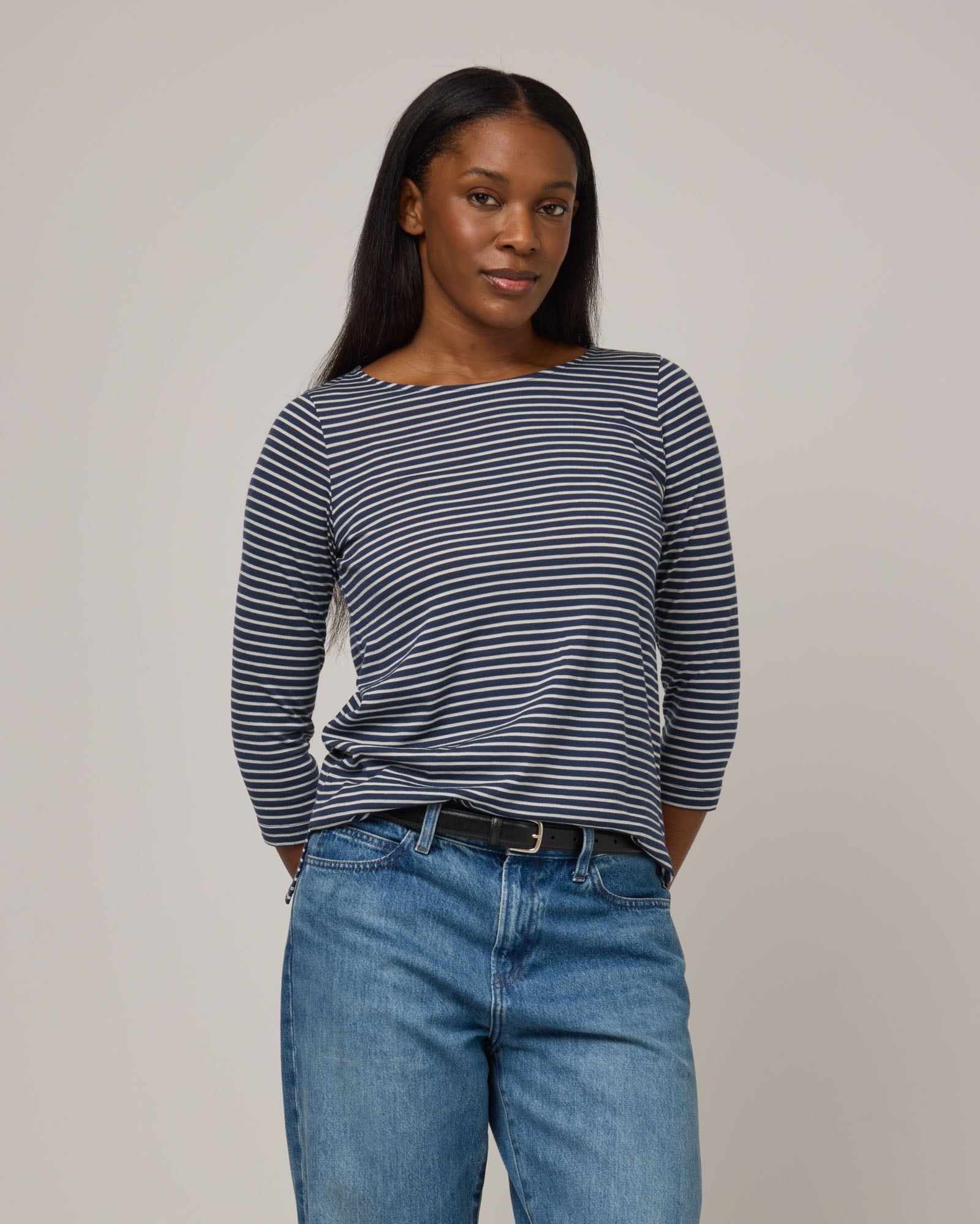 Model wearing Colette Quarter-Sleeve Top in Marine Blue & Natural White Stripe. Colette Quarter-Sleeve Top is a merino wool long sleeve, boatneck, regular fit top available in sizes XS-3X.