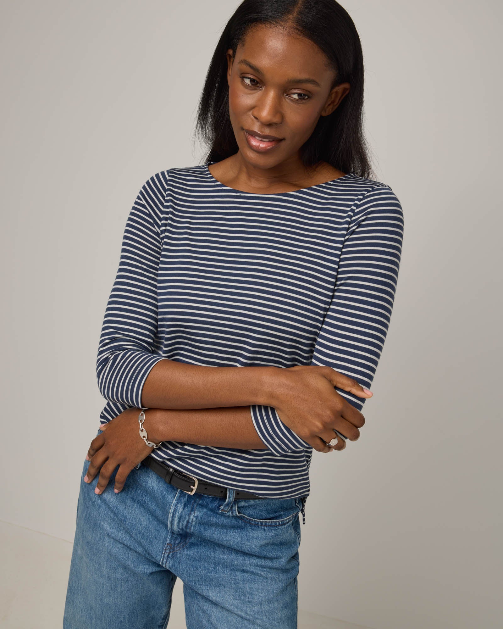 Model wearing Colette Quarter-Sleeve Top in Marine Blue & Natural White Stripe. Colette Quarter-Sleeve Top is a merino wool long sleeve, boatneck, regular fit top available in sizes XS-3X.