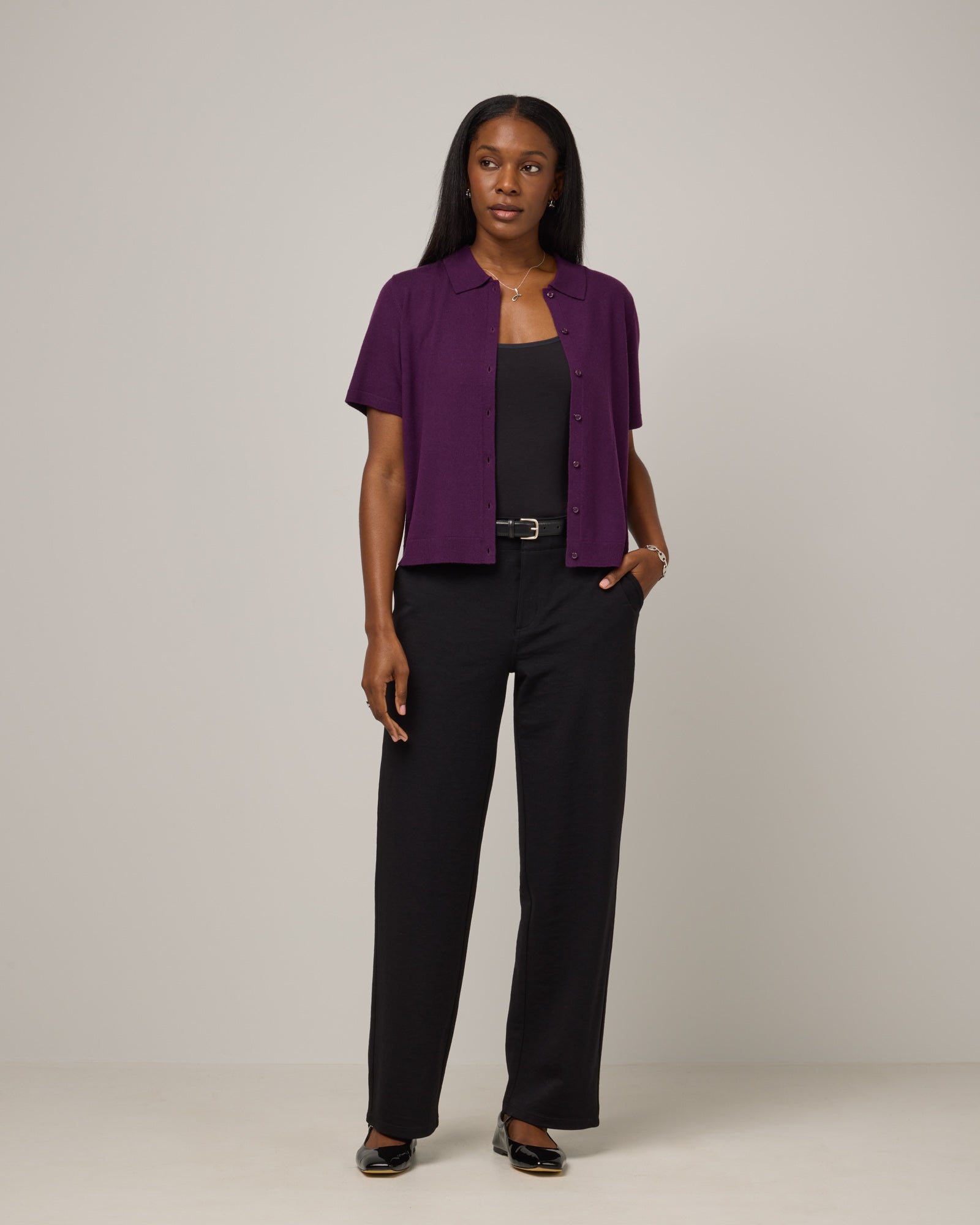 Model wearing Carson Ponte Trouser in Black. Carson Ponte Trouser is a merino wool pant with pockets available in sizes XS-3X Regular, XS-XL Petite.