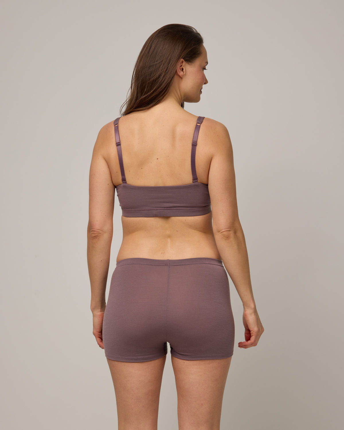 Model wearing Roam High Waist Shortie in Lavender, a dusky muted purple color. Roam High Waist Shortie is a merino wool underwear available in sizes XS-3X.