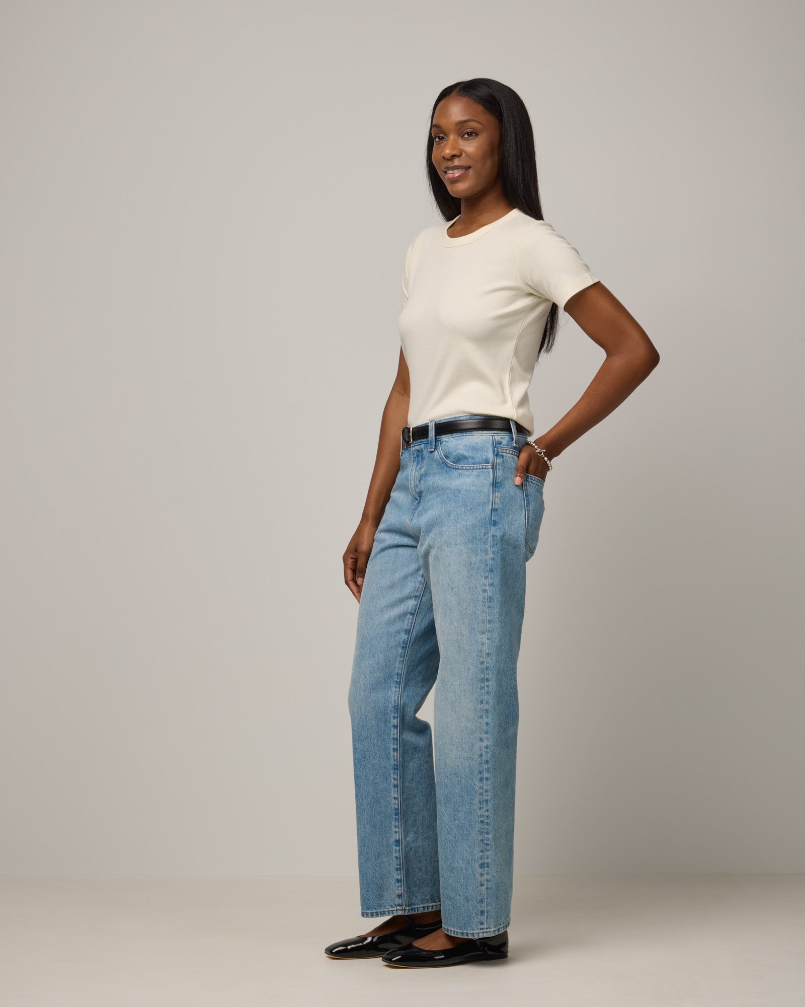 Model wearing Taylor Ribbed Tee in Natural White. Taylor Ribbed Tee is a merino wool short sleeve crew neck tee available in sizes XS-3X.
