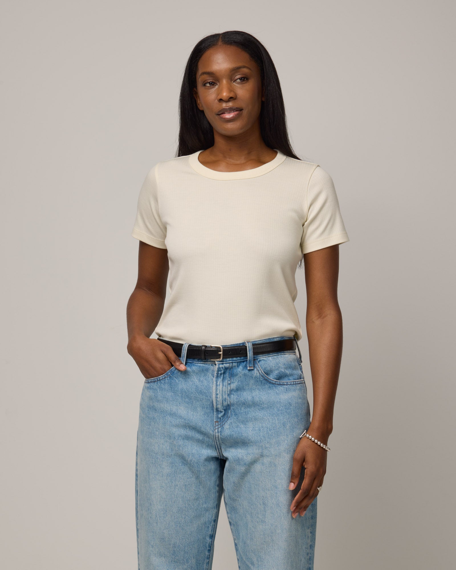 Model wearing Taylor Ribbed Tee in Natural White. Taylor Ribbed Tee is a merino wool short sleeve crew neck tee available in sizes XS-3X.