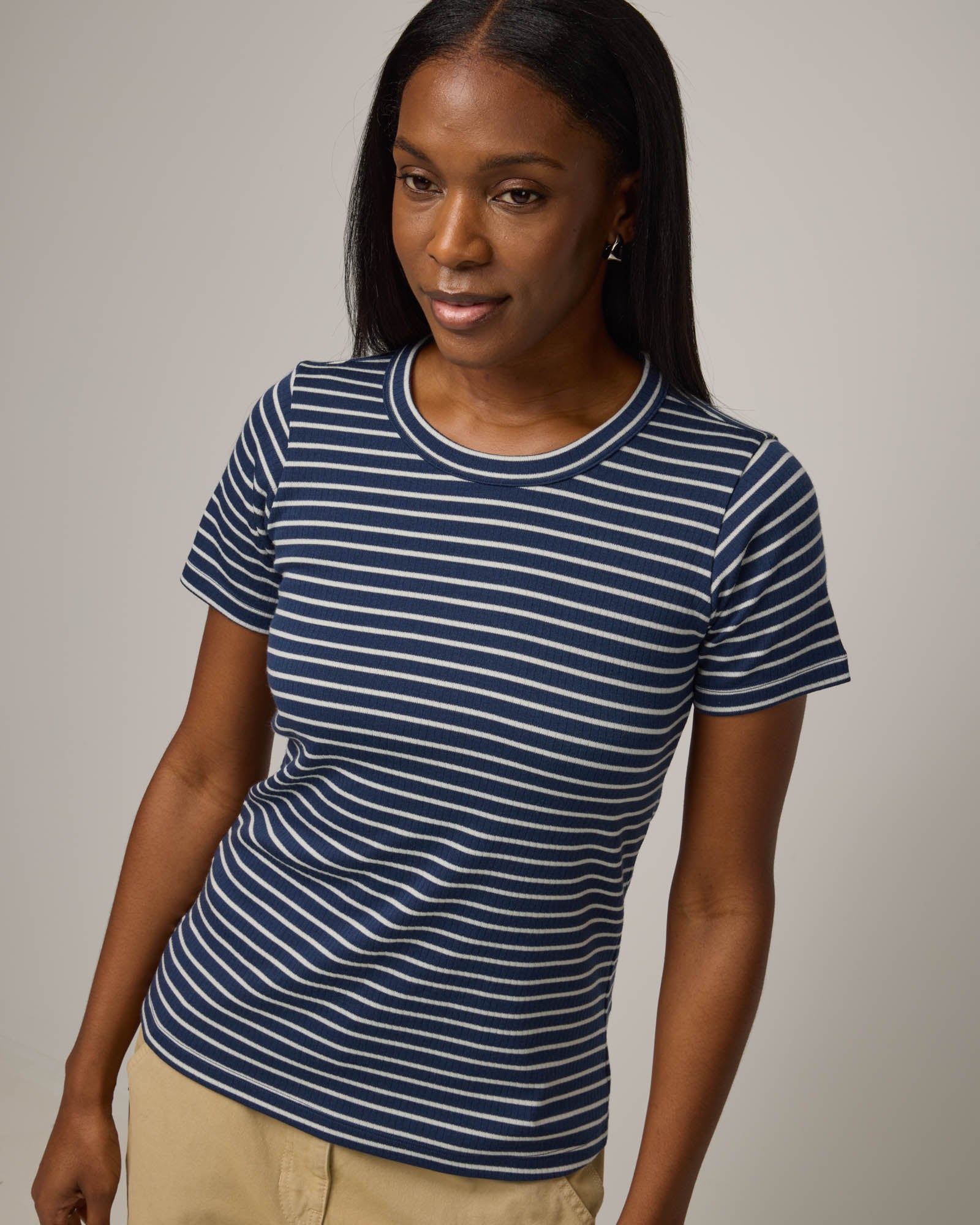 Model wearing Taylor Ribbed Tee in Marine Blue & Natural White Stripe. Taylor Ribbed Tee is a merino wool short sleeve, crew neck tee available in sizes XS-3X.