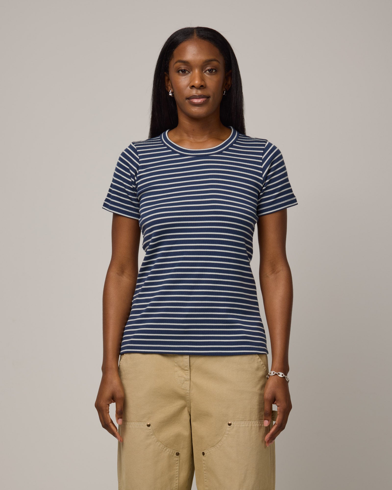 Model wearing Taylor Ribbed Tee in Marine Blue & Natural White Stripe. Taylor Ribbed Tee is a merino wool short sleeve, crew neck tee available in sizes XS-3X.