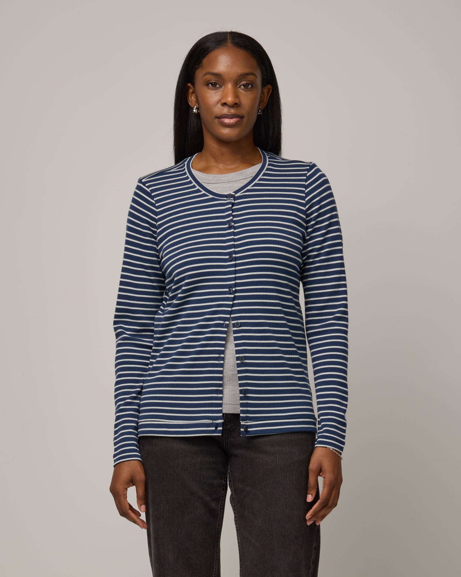 Model wearing Celeste Ribbed Cardigan in Marine Blue & Natural White Stripe. Celeste Ribbed Cardigan is a merino wool long sleeve, crew neck cardigan available in sizes XS-3X.