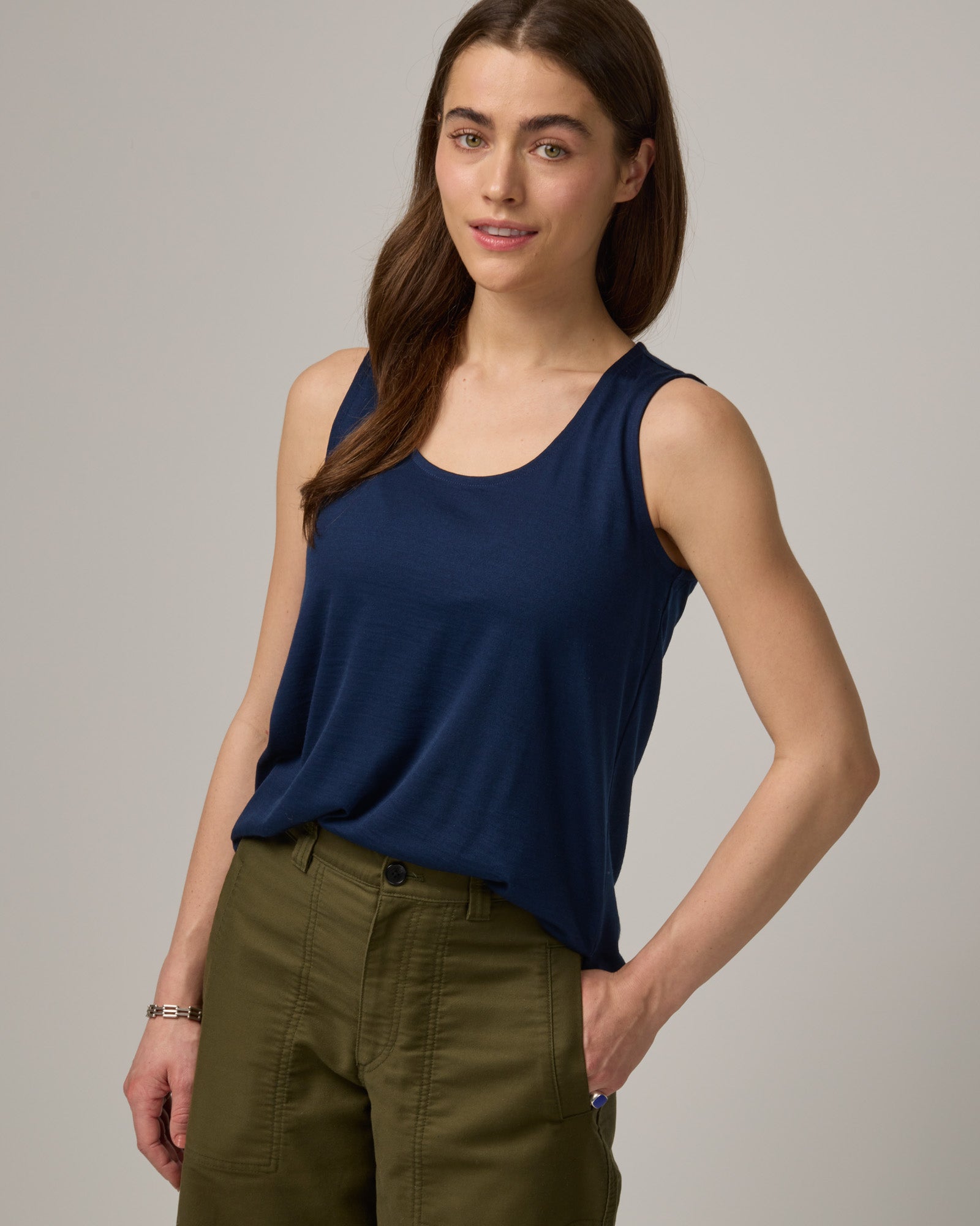 Model wearing Steph Scoop Neck Tank in Marine Blue, a deep royal blue color. Steph Scoop Neck Tank is a merino wool sleeveless tank available in sizes XS-3X.