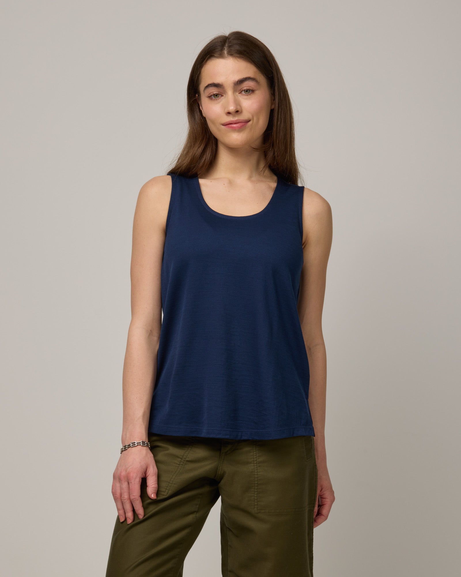 Model wearing Steph Scoop Neck Tank in Marine Blue, a deep royal blue color. Steph Scoop Neck Tank is a merino wool sleeveless tank available in sizes XS-3X.