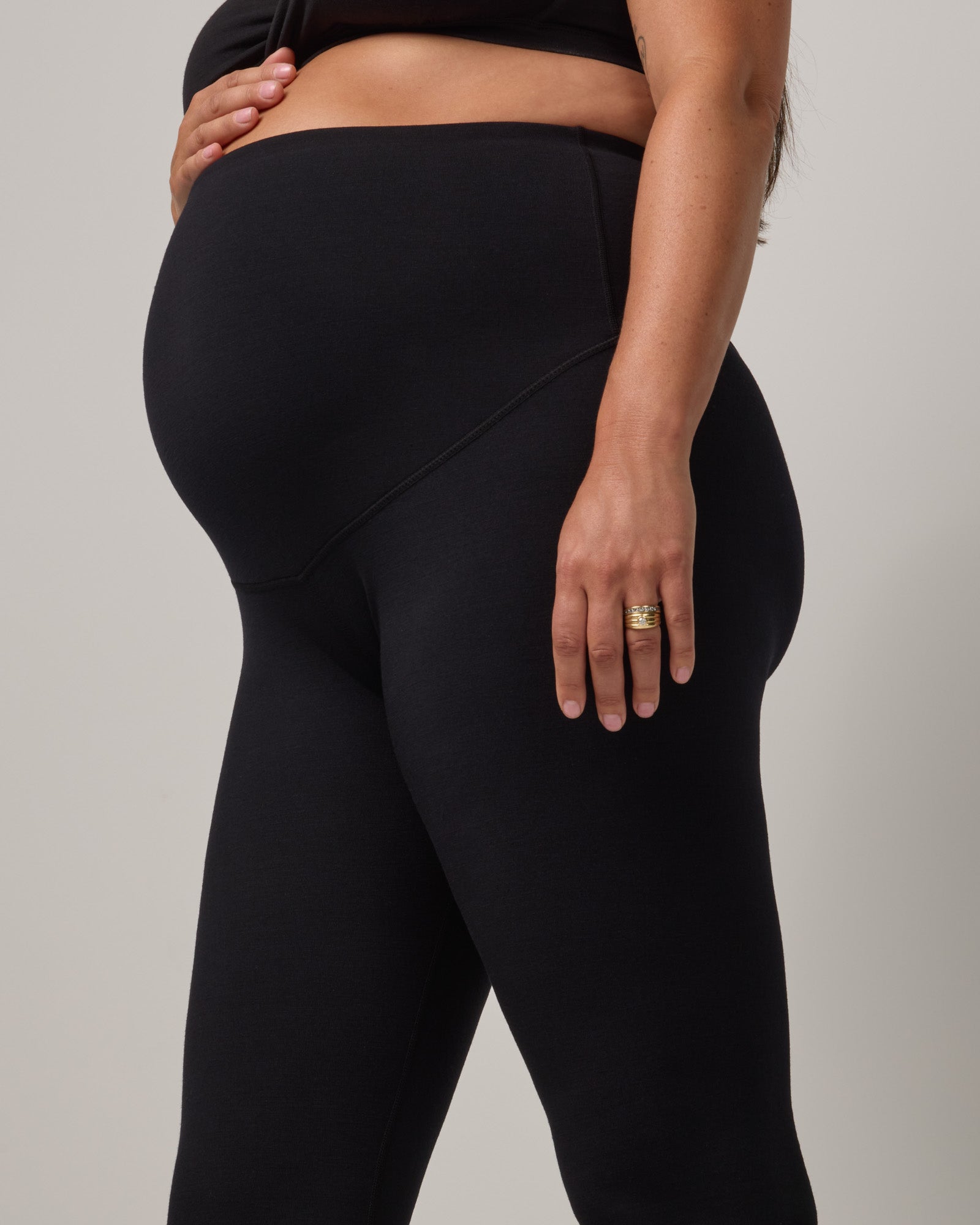 Model wearing Summit Maternity Leggings in Black. Summit Maternity Leggings are merino wool, full length leggings available in sizes XS-3X.