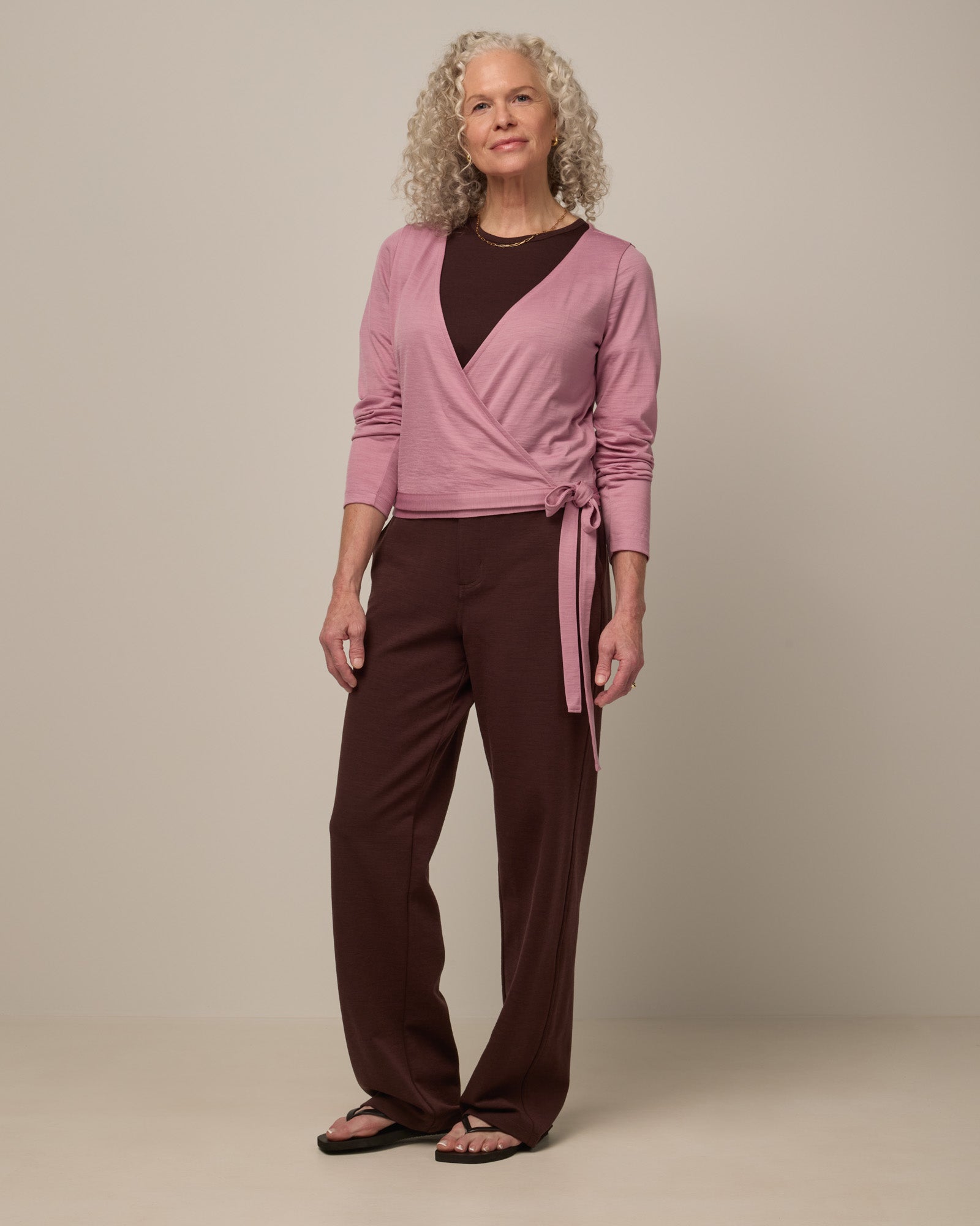 Model wearing Carson Ponte Trouser in Espresso, a warm brown color. Carson Ponte Trouser is a merino wool pant with pockets available in sizes XS-3X Regular, XS-XL Petite.