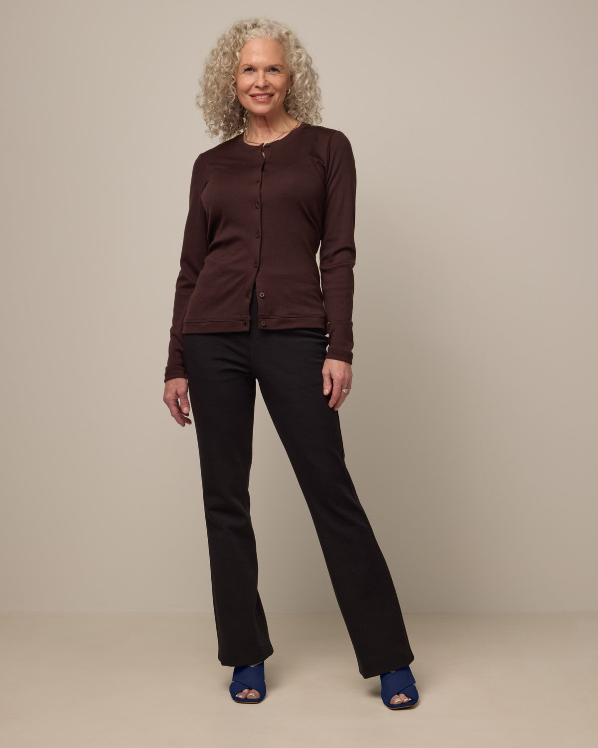Model wearing Foster Kick Flare Ponte Pant in Black. Foster Kick Flare Ponte Pant is a merino wool flare pant available in sizes S-3X Regular, S-XL Long, and XS-XL Petite.