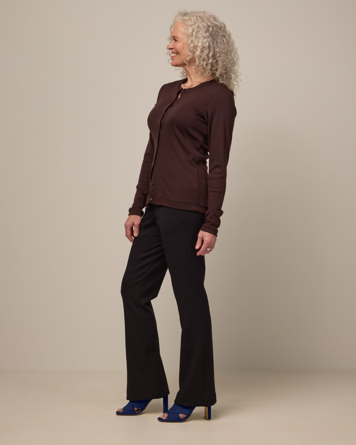 Model wearing Foster Kick Flare Ponte Pant in Black. Foster Kick Flare Ponte Pant is a merino wool flare pant available in sizes S-3X Regular, S-XL Long, and XS-XL Petite.