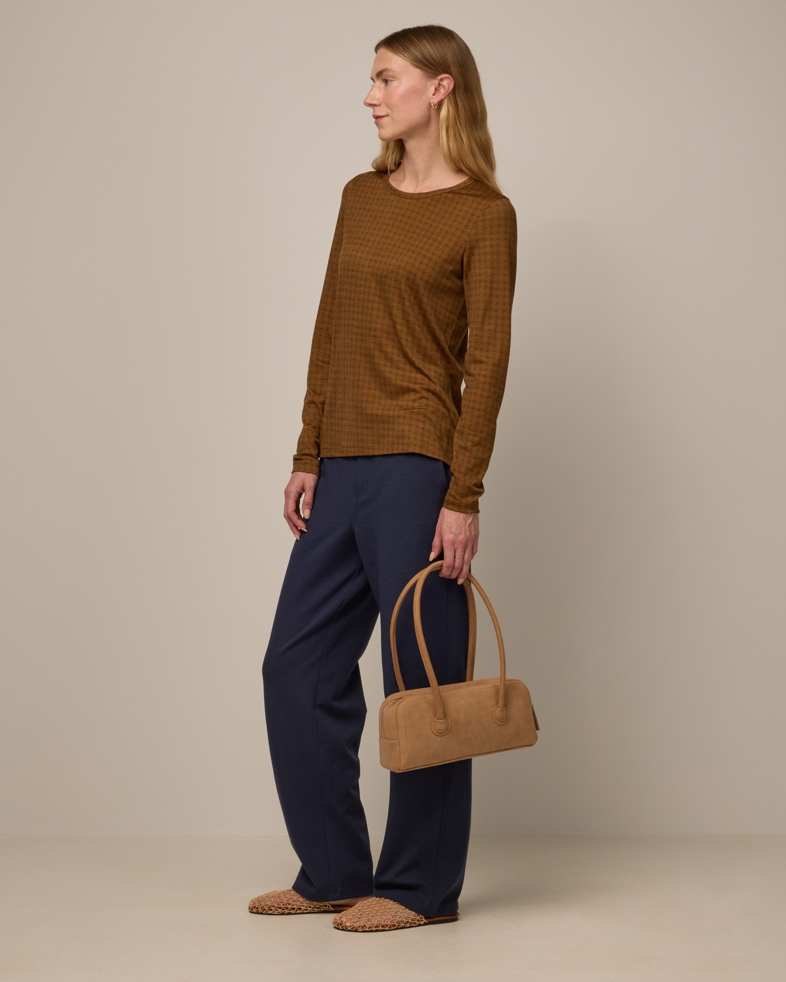 Model wearing Carson Ponte Trouser in Washed Navy. Carson Ponte Trouser is a merino wool pant with pockets available in sizes XS-3X Regular, XS-XL Petite.