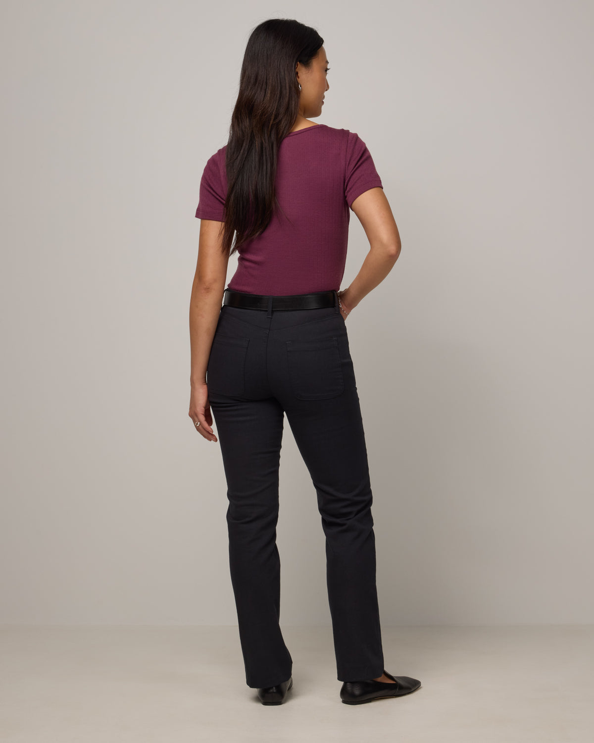 Model wearing Hawthorne Straight Leg Denim Jean in Black. Hawthorne Straight Leg Denim Jean is a merino wool jean available in sizes 26-34.