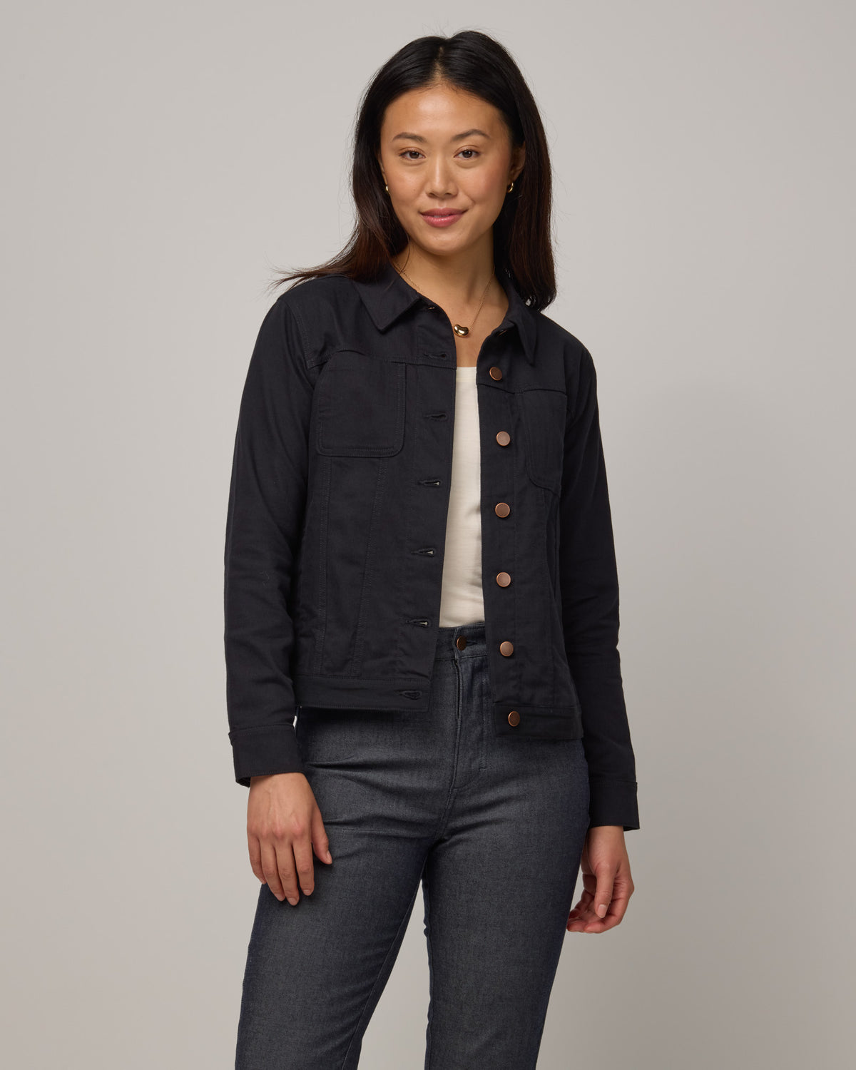 Model wearing Logan Denim Jacket in Black. Logan Denim Jacket is a merino wool classic long sleeve, collared denim jacket available in sizes XS-XXL.