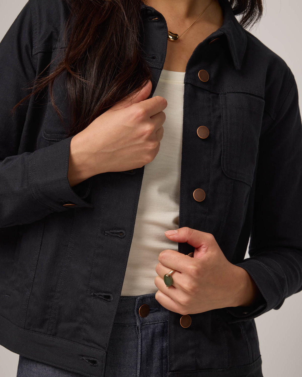 Model wearing Logan Denim Jacket in Black. Logan Denim Jacket is a merino wool classic long sleeve, collared denim jacket available in sizes XS-XXL.