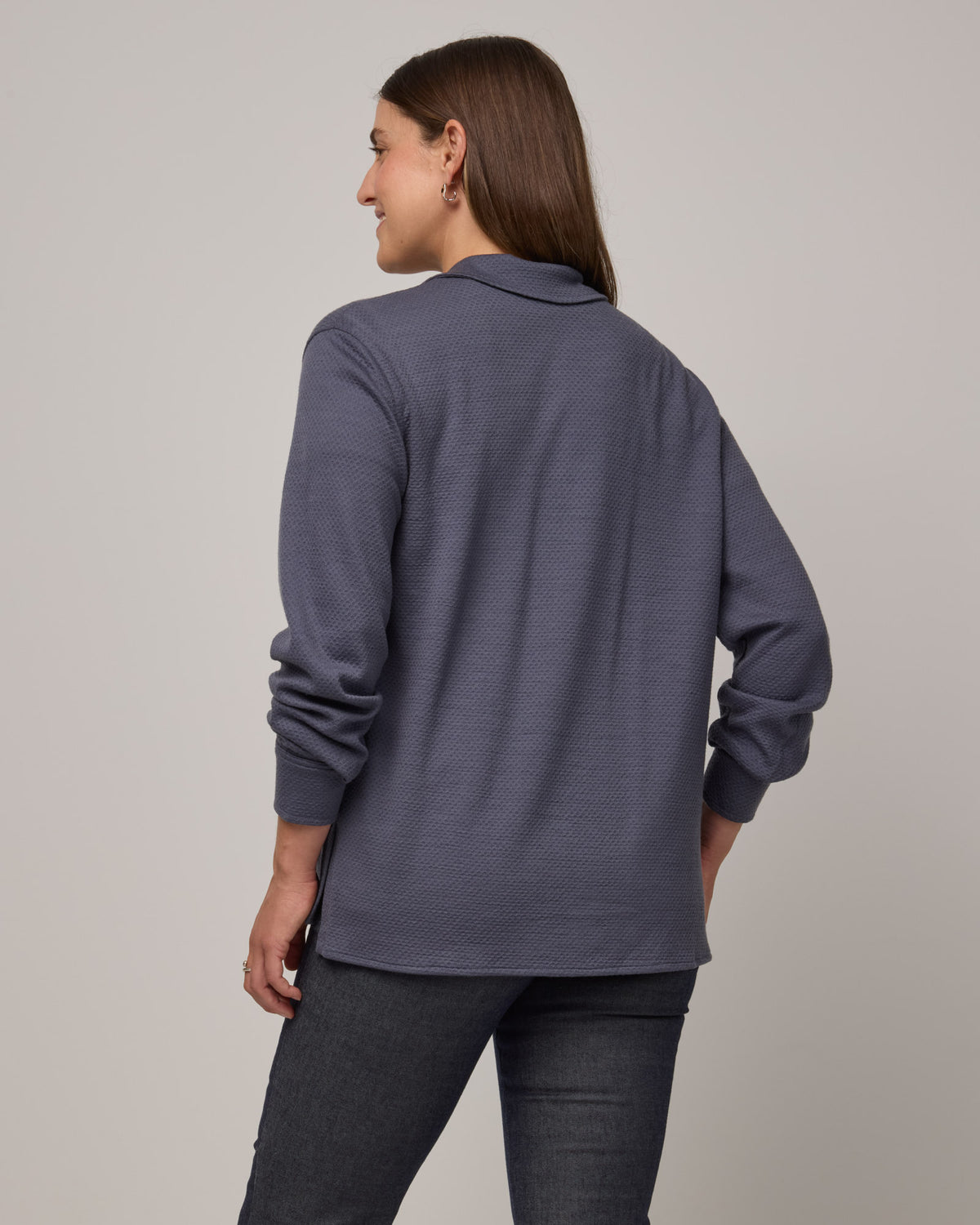 Model wearing Dani Relaxed Button-Front Shirt in Odyssey Gray, a slate blue-gray color. Dani Relaxed Button-Front Shirt is a merino wool long sleeve, collared button-down shirt available in sizes XS-3X.